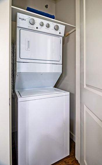 stacked washer and dryer in State Street Flats west nashville apartment with laundry in-unit