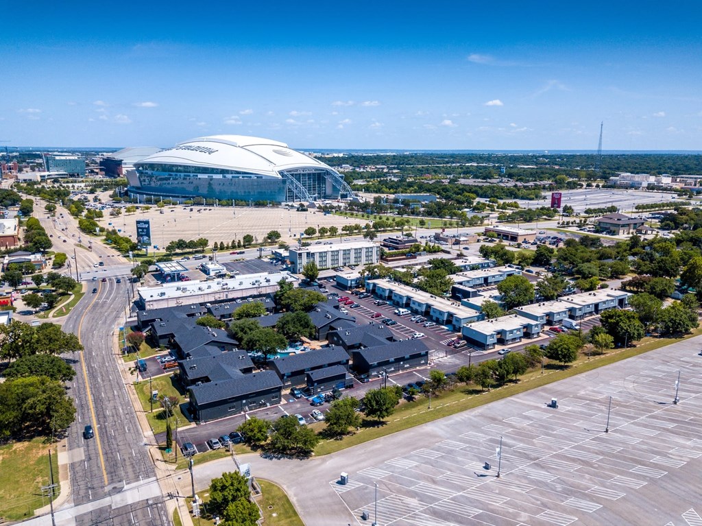 Aerial view of Studio 700 apartments in Arlington, Texas with AT&T Stadium in walking distance in the background.