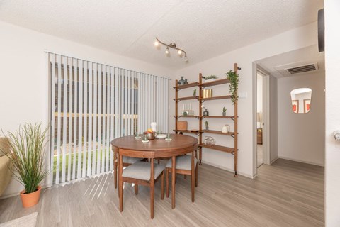 Fusion 35 dining room with a wooden table and chairs.