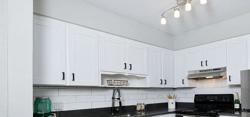 Mandarin Bay Apartments - Kitchen Apartments for Rent in Jacksonville, FL - Mandarin Bay Kitchen with Stainless Steel Appliances and Modern White Wood Cabinets - Photo Gallery 5