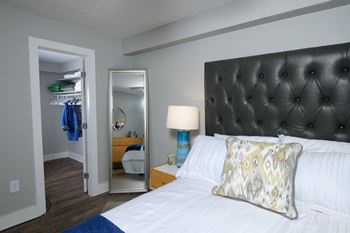 Bedroom in Mandarin Bay apartment in Jacksonville with large bed and walk-in closet.