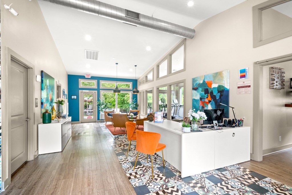 Retreat at Indian Lake Hendersonville TN leasing office with a white reception desk and orange chairs.