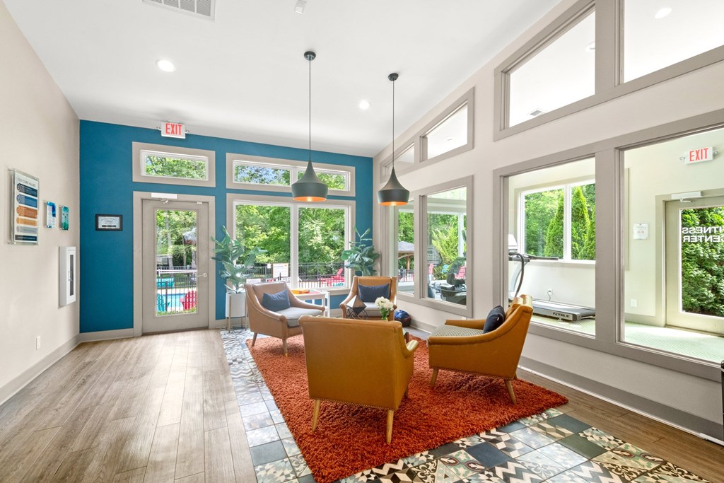 Retreat at Indian Lake Hendersonville TN brightly lit leasing office with a blue wall and a red rug.