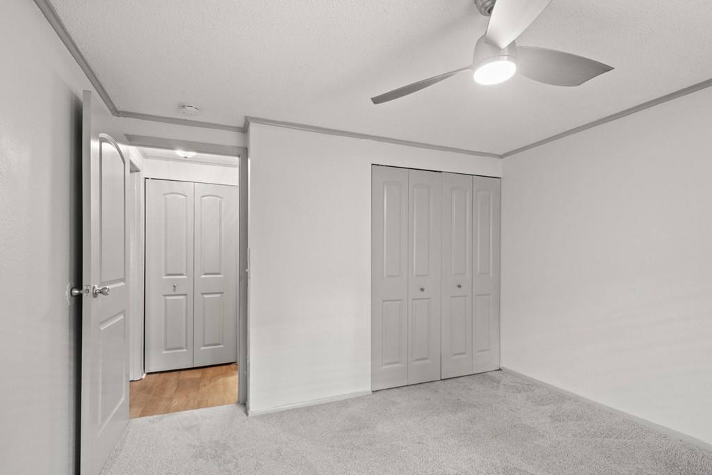 Retreat at Indian Lake Hendersonville TN apartments bedroom with two doors and a ceiling fan.