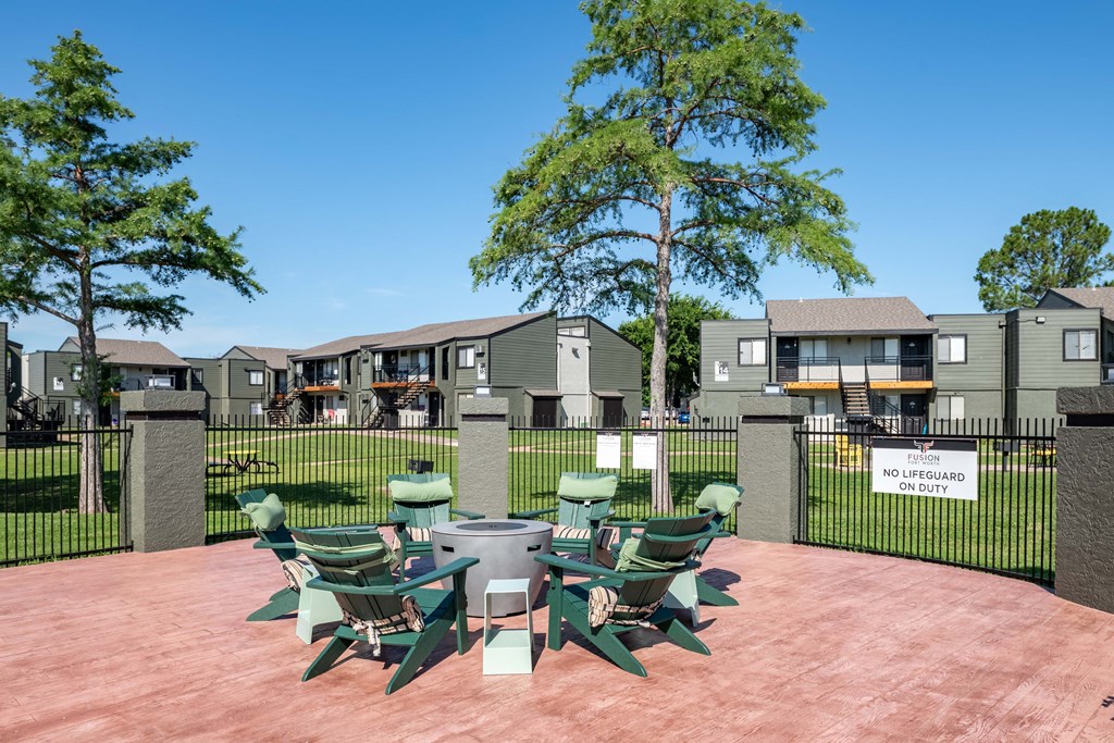 a patio with a table and chairs on a patio