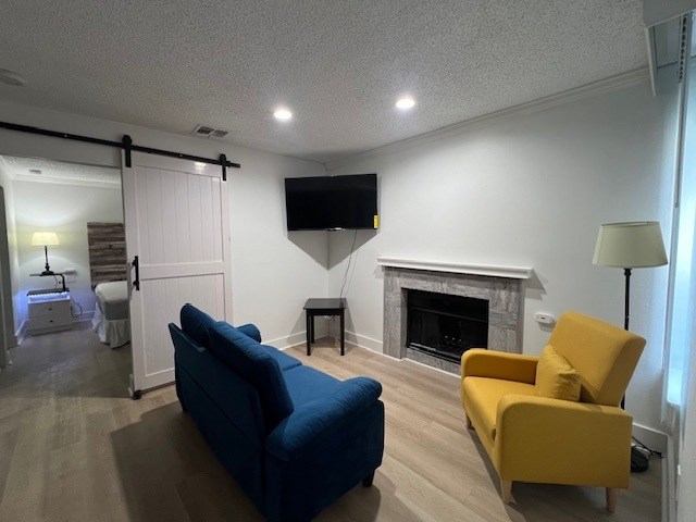 Fusion Orlando Apartments living room with a blue couch and yellow chair.
