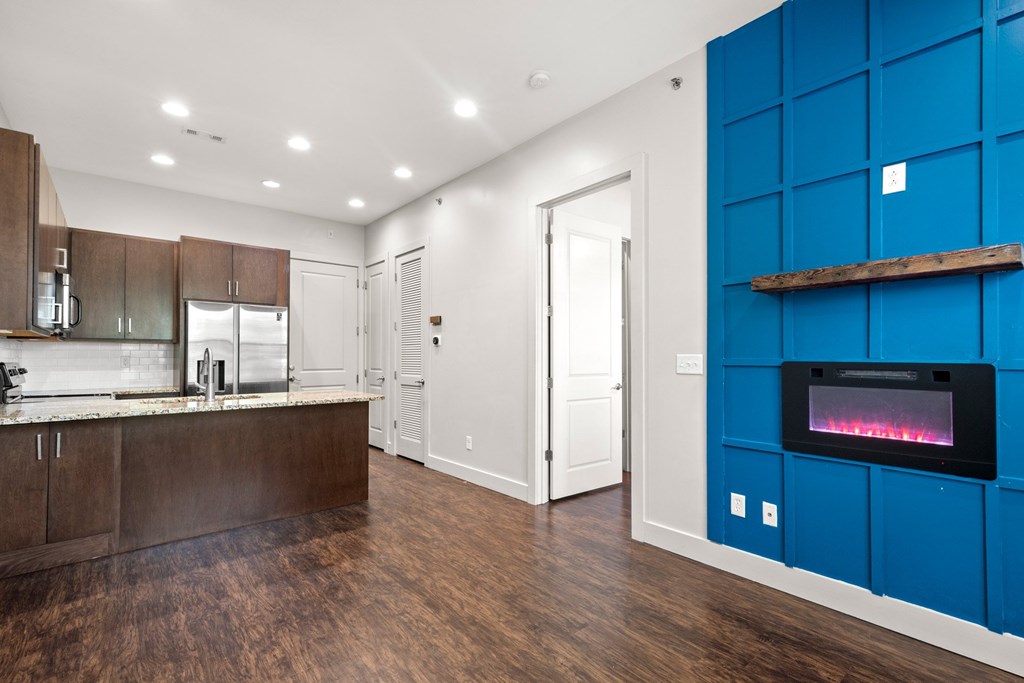 State Street Flats 1 bedroom apartments Nashville TN modern kitchen with a wood, white, and blue color scheme.