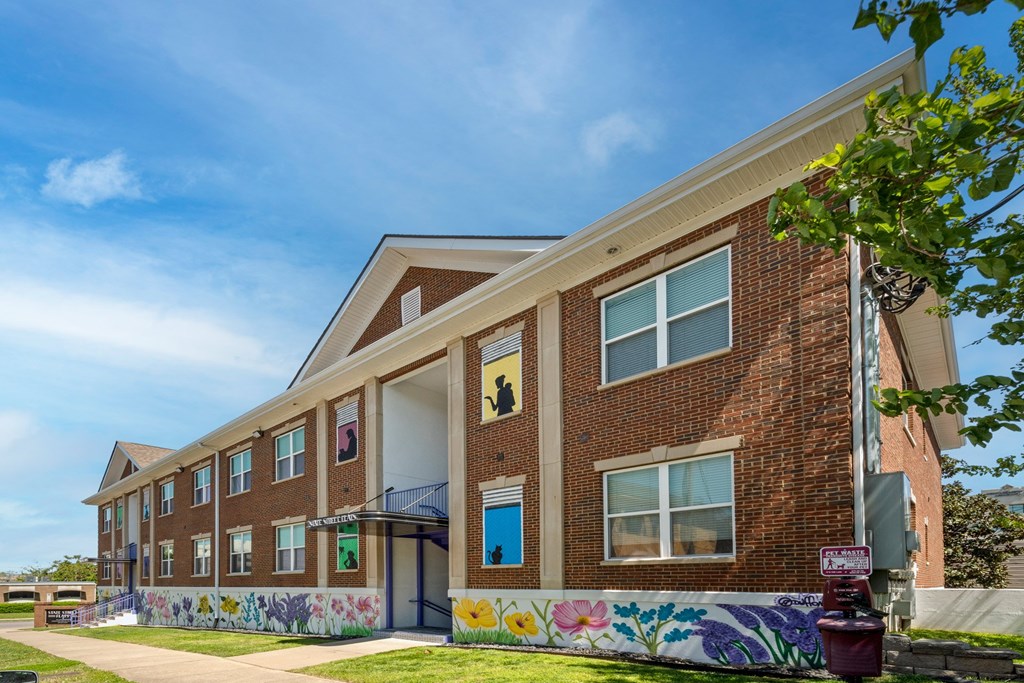 State Street Flats - Apartments for rent in West Nashville TN - red brick building with a mural on the side.