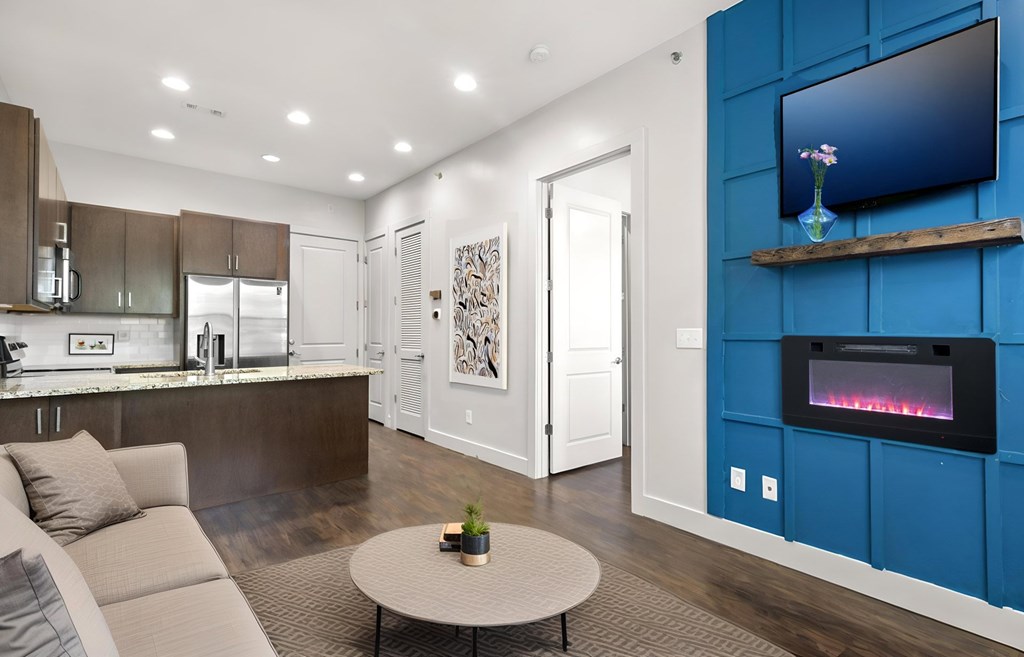 State Street Flats 1 bedroom apartments Nashville modern living room with a grey sofa and a coffee table.