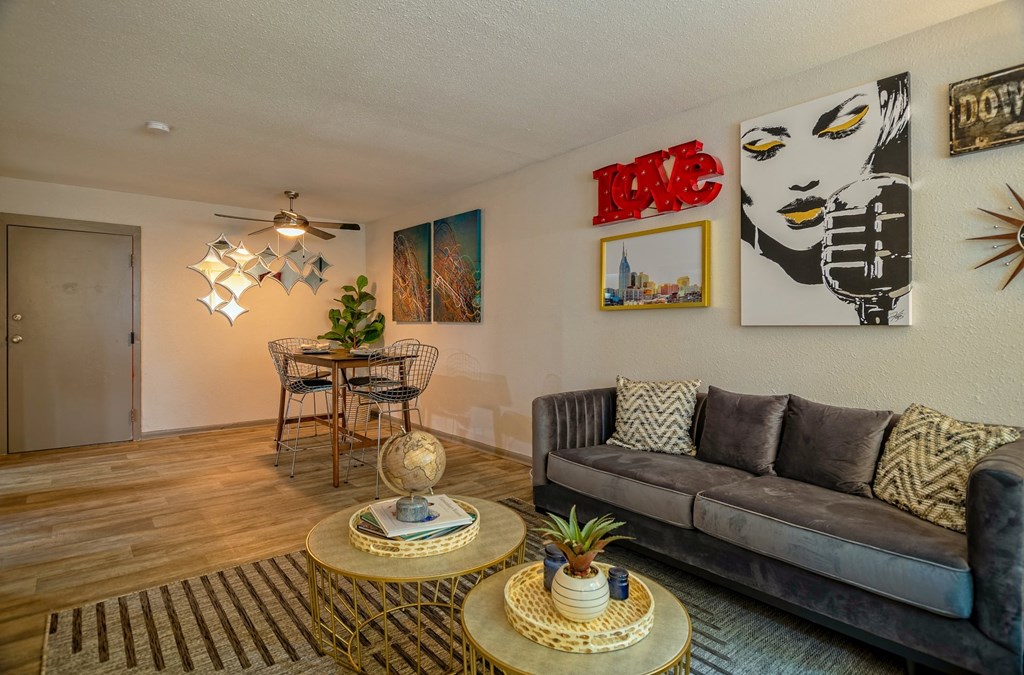 Open concept Living room in the Canvas Apartments in Nashville and dining nook with midcentury modern luxury decor.