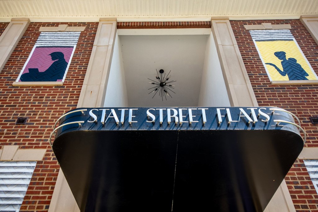 A sign that says State Street Flats