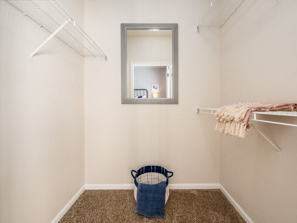 a walk in closet in a 555 waverly unit