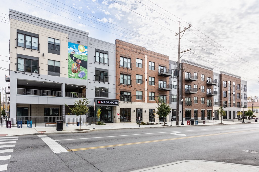 Exterior view of Madamore Apartments featuring the street in front.