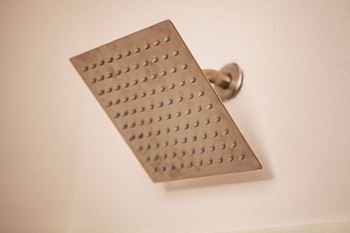 a shower head with a shower peg on it