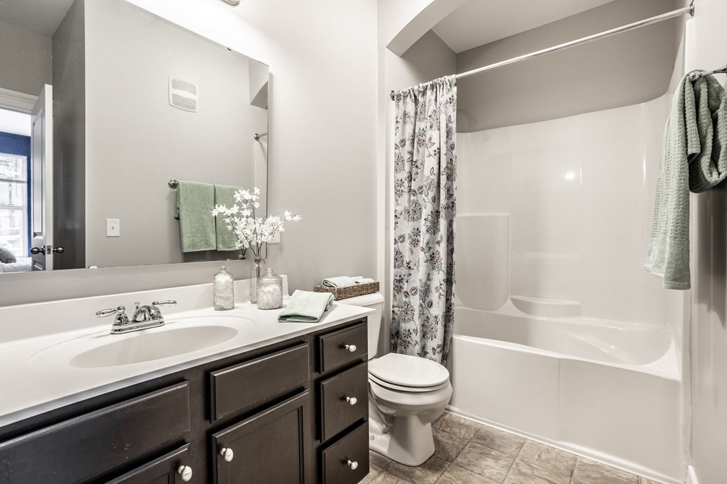 a bathroom with a toilet sink and bathtub