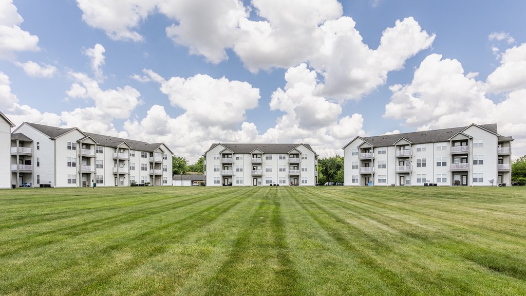 Apartments In Indianapolis, IN For Rent - Riverchase - Beautifully Landscaped Courtyard In Front Of Apartment Buildings