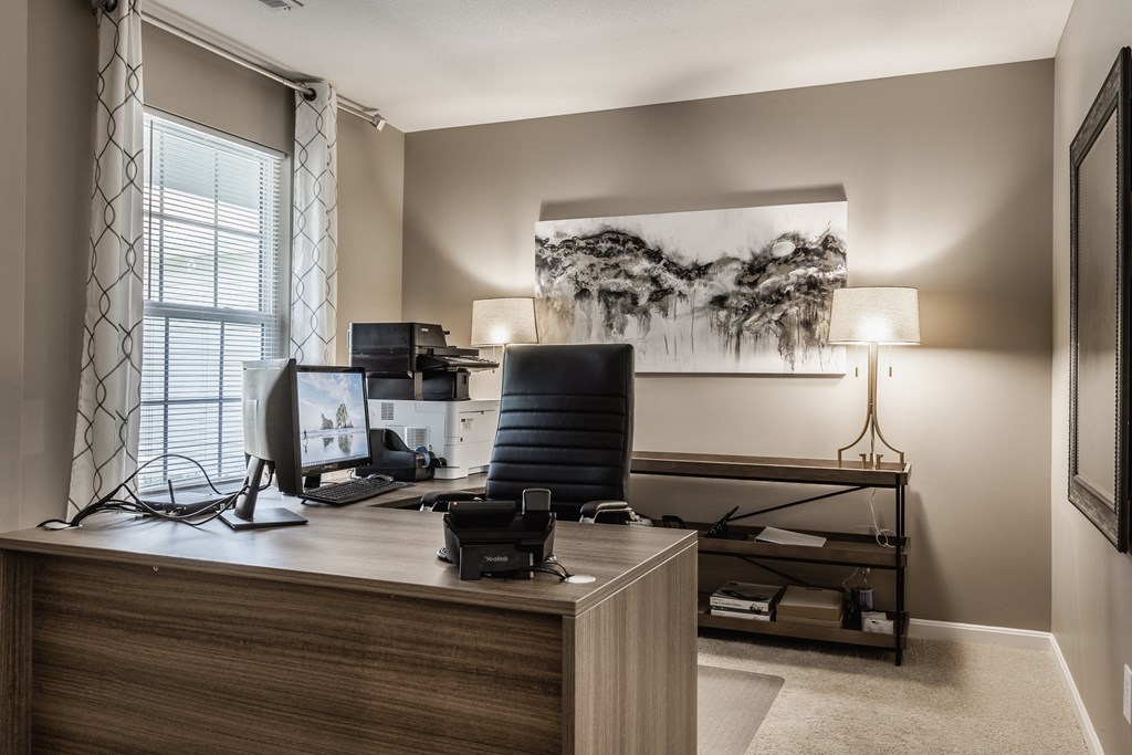 Dedicated home office setup featuring a desk and computer