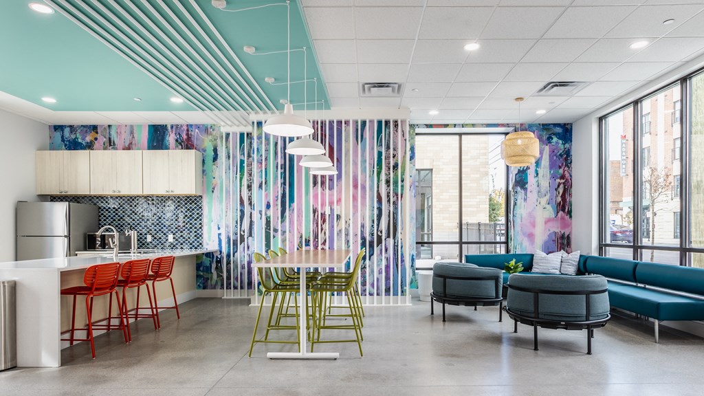 A lounge with a selection of seating areas, light fixtures, and stylish decor.