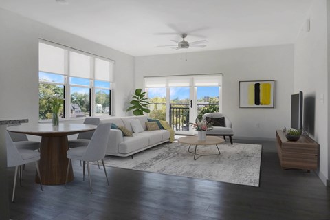 a living room with a white couch and a dining room table