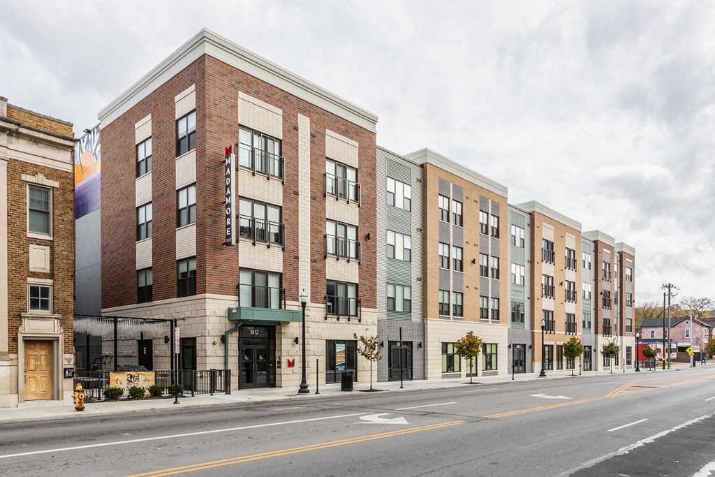 Madamore exterior view with buildings and a street.