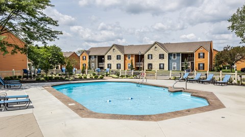 A swimming pool surrounded by chairs and concrete at Fairway Lakes in Westerville, OH.