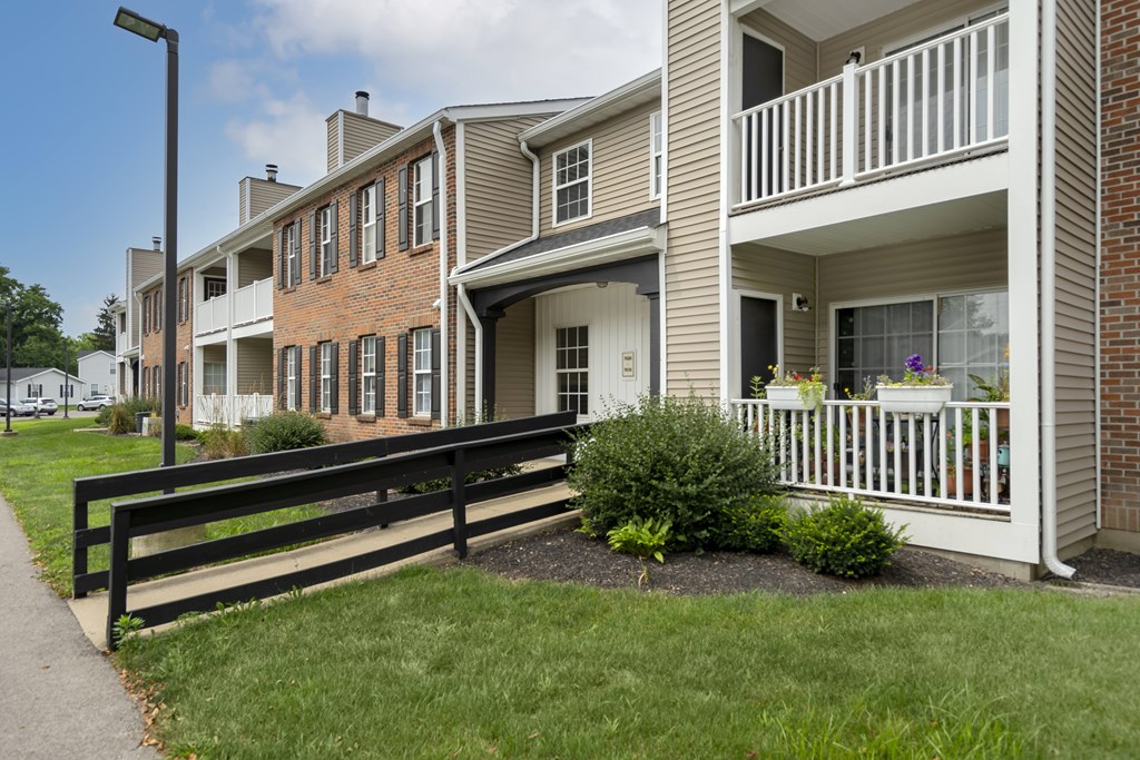 A building with a balcony and a black railing.