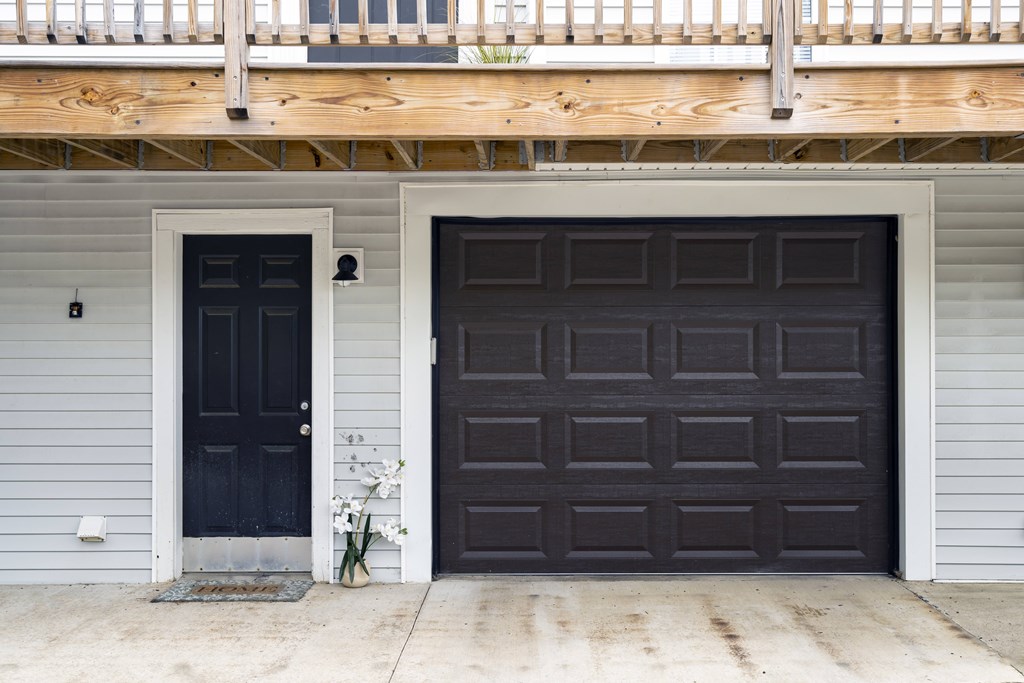 A black door is on the left and a brown door is on the right.