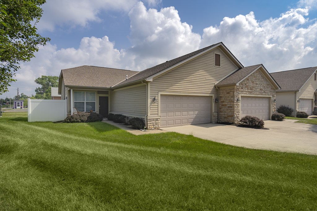 A house with a garage and a driveway.