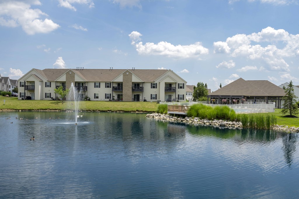 A large building with a fountain in front of it.
