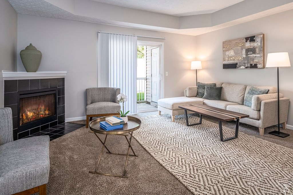 A living room with a fireplace and a couch.