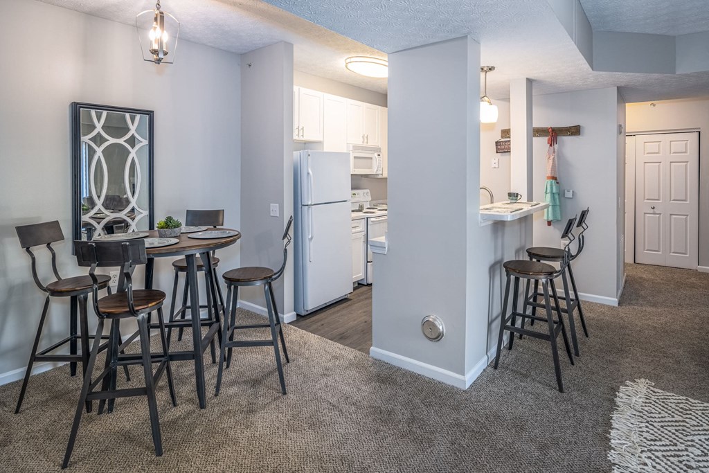 a living room with a dining area and a kitchen
