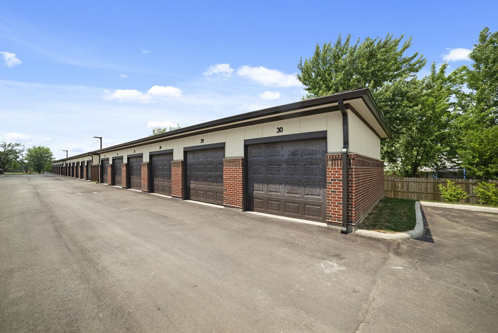 1 BR Apartments in Miamisburg, OH - Austin Park - Detached Single Car Garages with Alleyway and Trees.