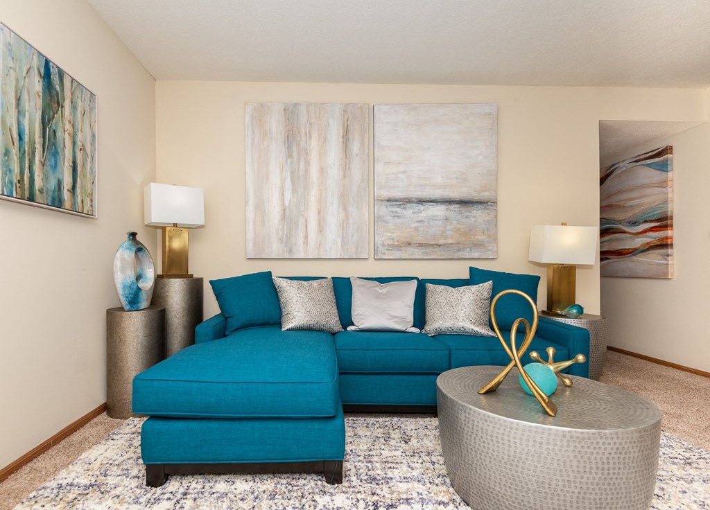 Dog-Friendly Apartments in Hilliard, OH - Residences at Breckenridge - Living Room with Sectional, Coffee Table, and End Tables with Lamps.