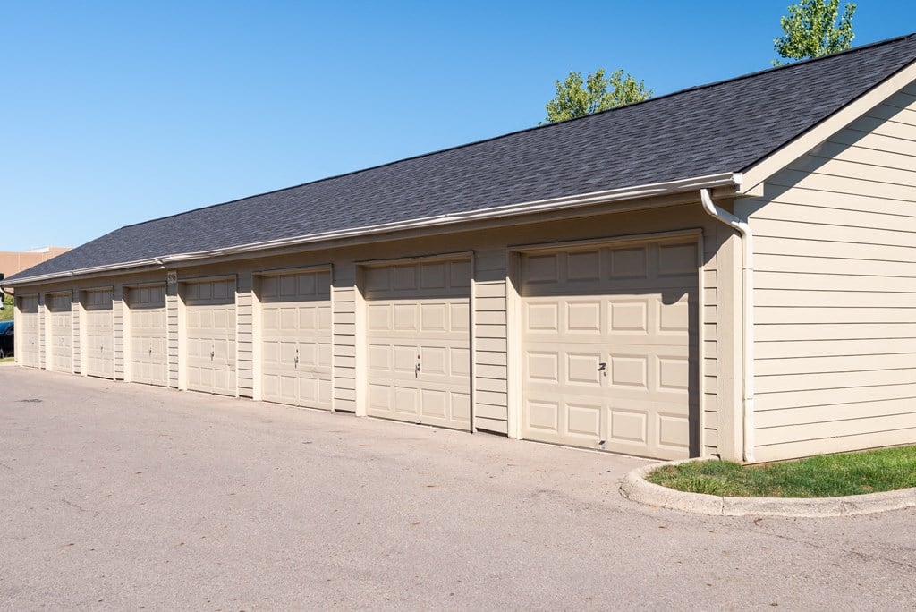 Row of closed garage doors in a residential apartment complex