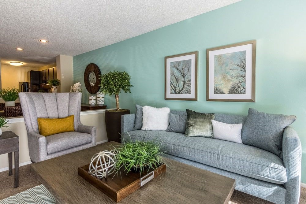 a living room with a couch and a chair