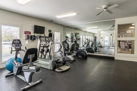 24-hour fitness center at Britton Woods Apartments in Dublin, Ohio, featuring free weights and cardio machines