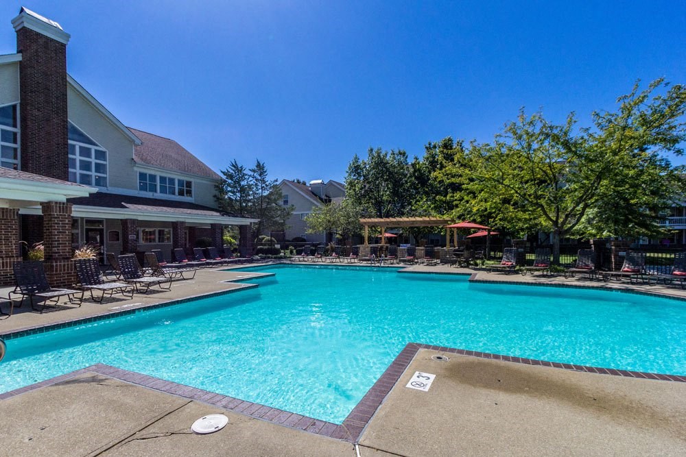 Apartments in Dublin, OH for Rent - Britton Woods - Resort-Style Swimming Pool with Lounge Chairs, Gazebo, Grill Area, Clubhouse, and Nice Landscaping