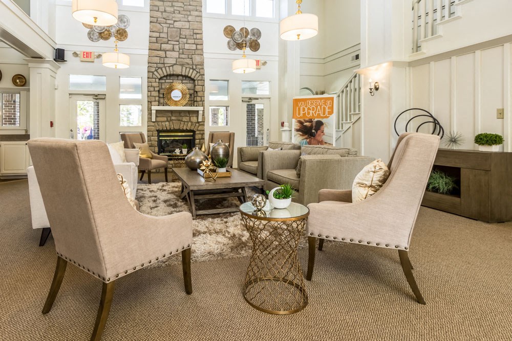 Britton Woods Apartments Dublin Ohio Pet Friendly Updated Renovated Clubhouse with Large Brick Fireplace for Community and seating for gatherings.