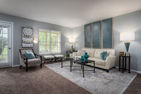 a living room with gray walls and a white couch
