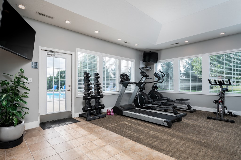 the gym at the enclave at woodbridge apartments in sugar land, tx