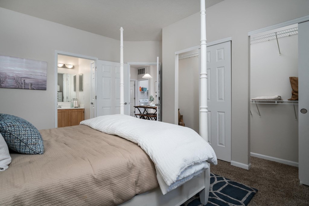 Two BR Apartments in Pataskala, OH - Catalina Club - Furnished Bedroom with Carpet Flooring, Large Closets, and a Bathroom