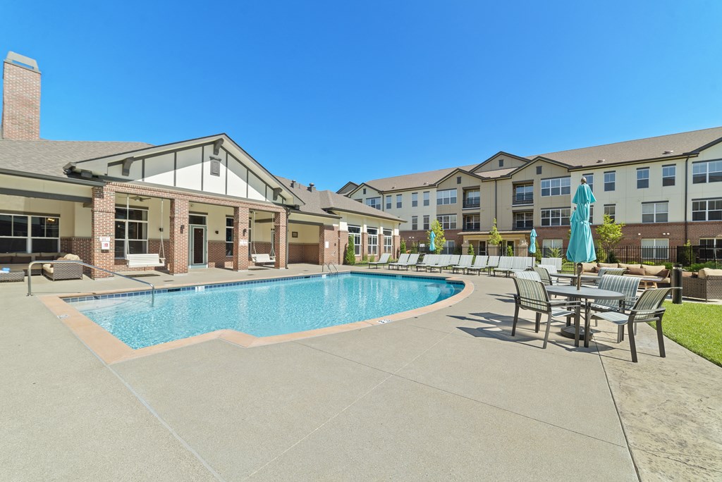 Austin Park Apartments Miamisburg Ohio Pet Friendly Amenity Resort Style Swimming Pool and Sundeck with Shaded tables and lounge chairs