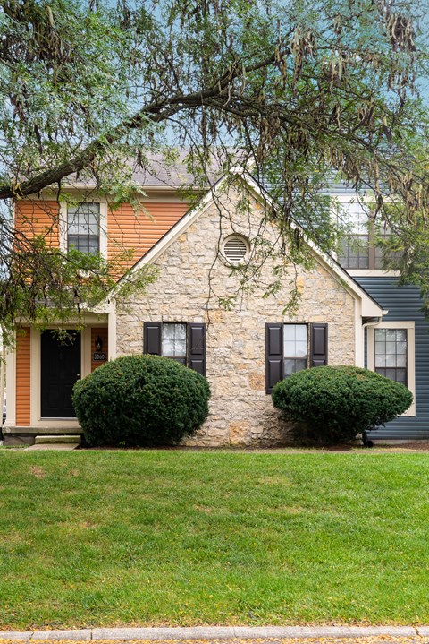 Fairway Lakes exterior featuring a tree and landscaped grounds.