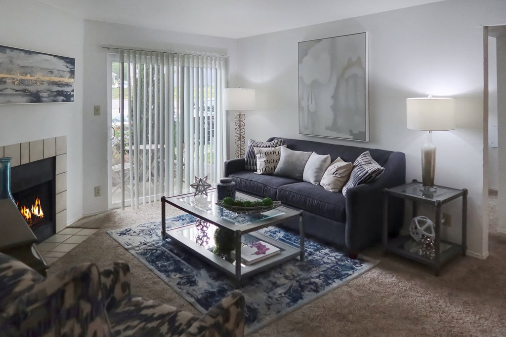 Cozy living room with a sofa, coffee table, and fireplace