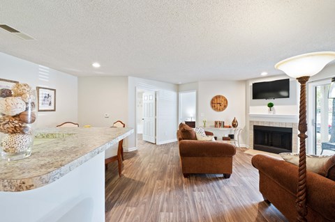 a living room with a couch and a fireplace