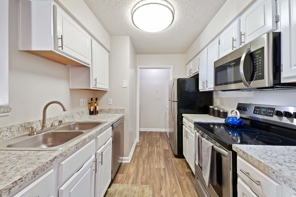 Reserve at Hamburg kitchen with stainless steel appliances and granite countertops