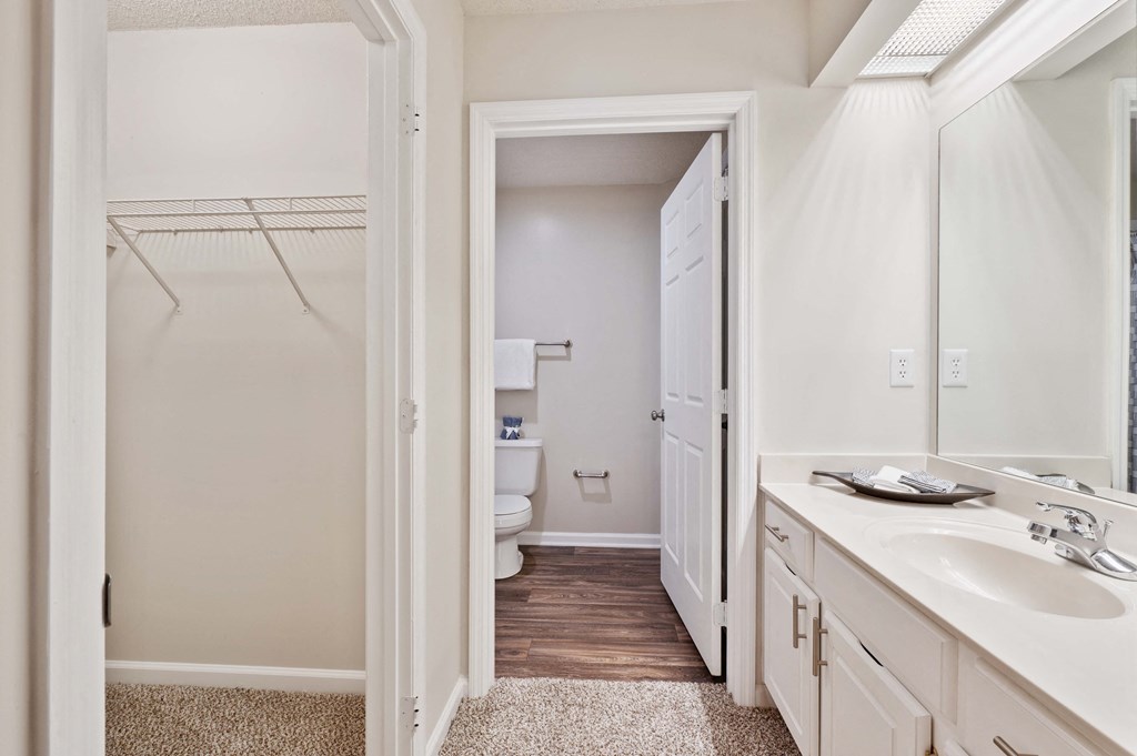 Reserve at Hamburg bathroom is connected to large walk in closet, toilet, and oval tub bath