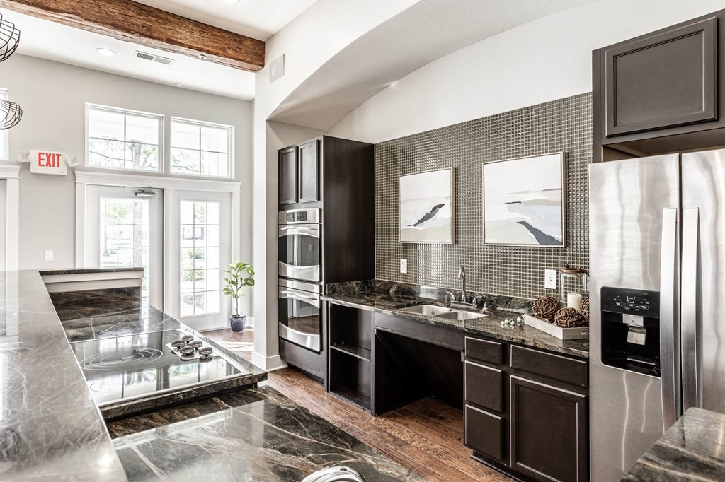A modern kitchen with a black and white color scheme.