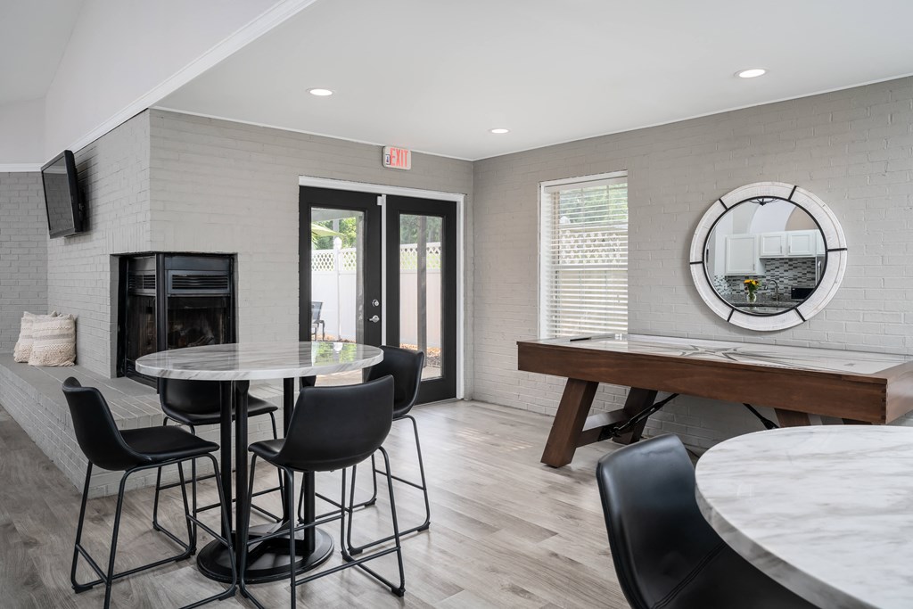 a room with a table and chairs