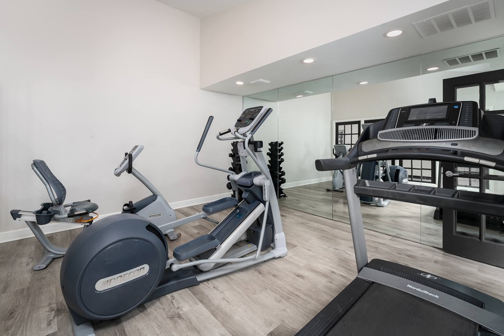 2 BR Apartments in Reynoldsburg, OH - The Oaks - Fitness Center with Mirror Wall and Cardio Equipment